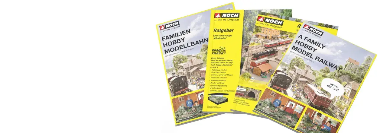 Broschüren für die Faszination Modellbau: Familien Hobby Modellbahn und A Family Hobby Model Railway, mit detaillierten Anlagen und Anleitungen.